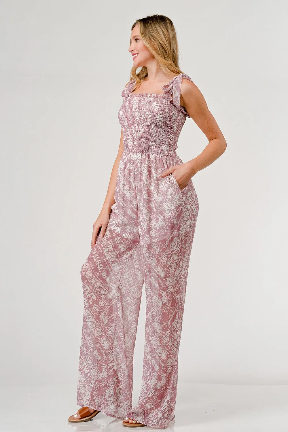 Bedruckter Jumpsuit mit weitem Bein und Bindeband an den Schultern von Sunset and Swim