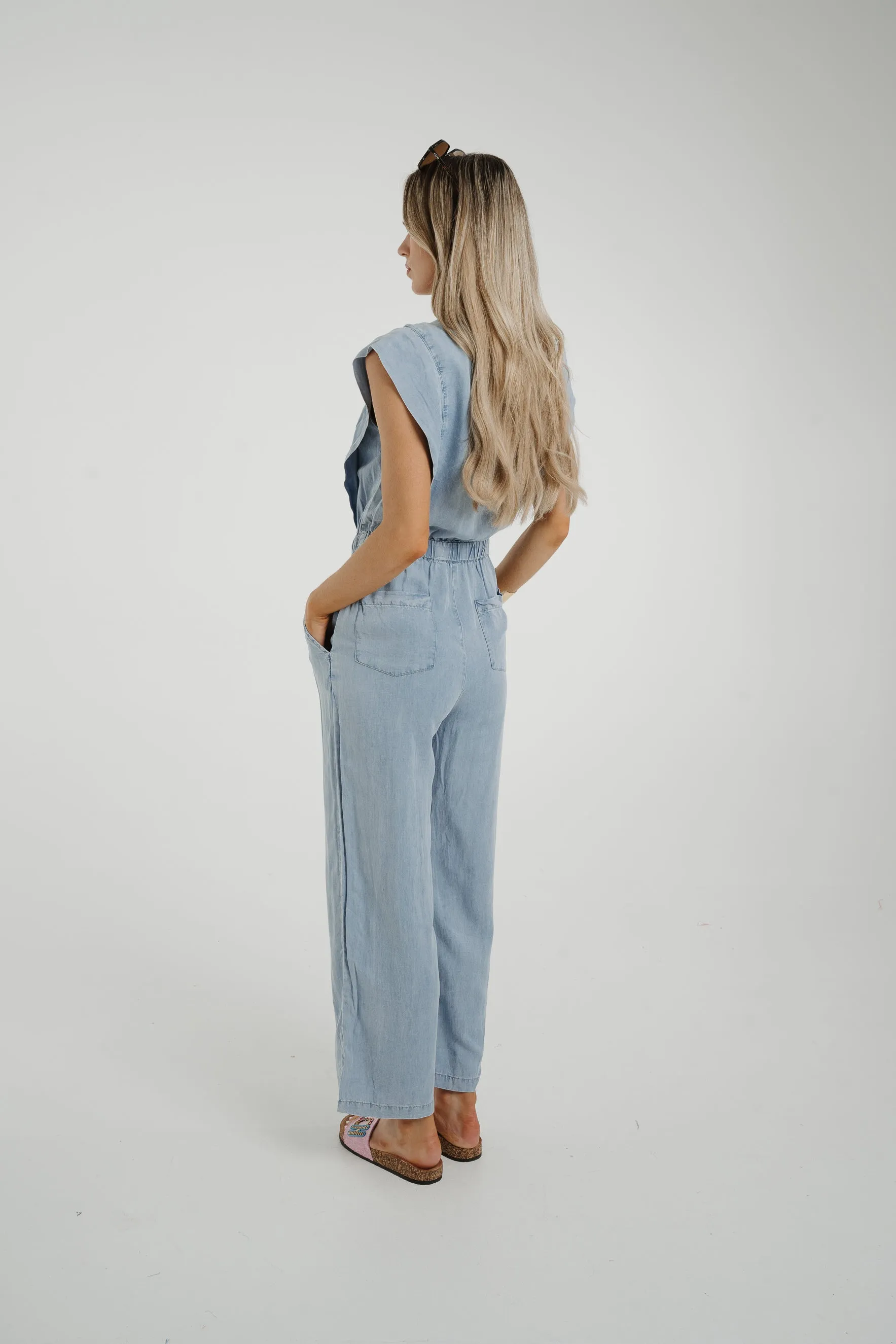 Cora Frill Shoulder Jumpsuit In Light Wash